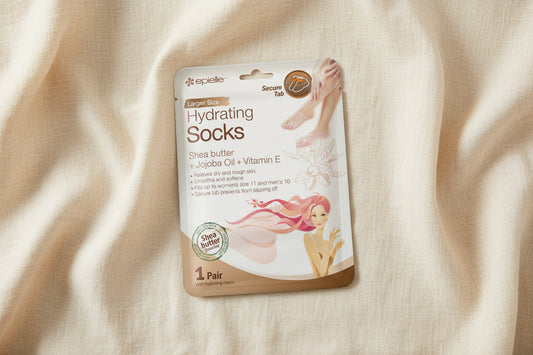 Packaging of epielle hydrating socks with a woman's feet and pink hair on a white background