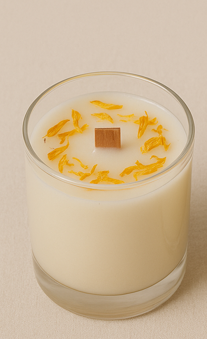 Three small candles in glass containers with decorative elements on a beige background