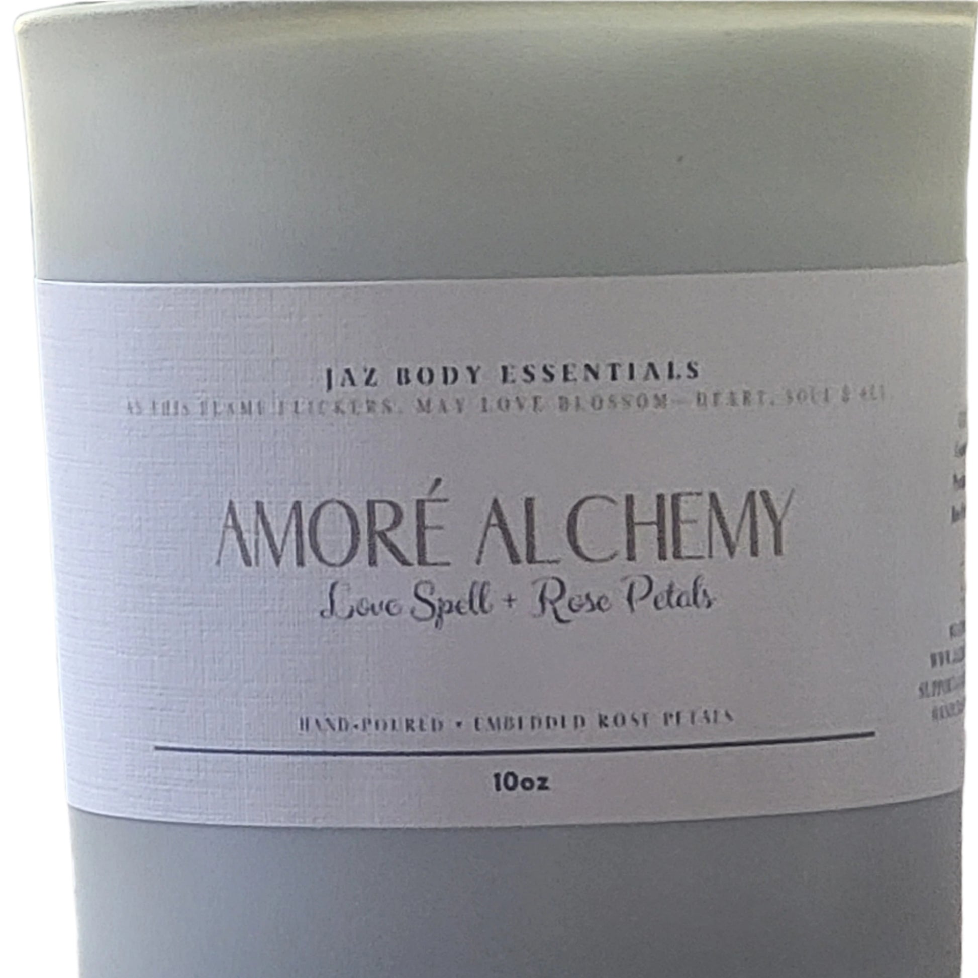 Product packaging with 'AMORE ALCHEMY' branding on a textured surface