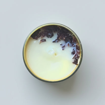 Round container with a yellowish lid on a textured surface