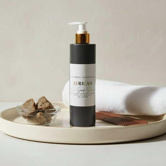 Black bottle with white label on a concrete surface