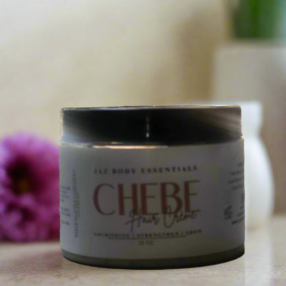 Jar of Chebe hair crème with a blurred background