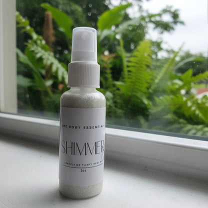 Spray bottle labeled 'Shimmer' on a windowsill with greenery outside